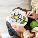 Creating handmade a simple little white flower punch needle artwork