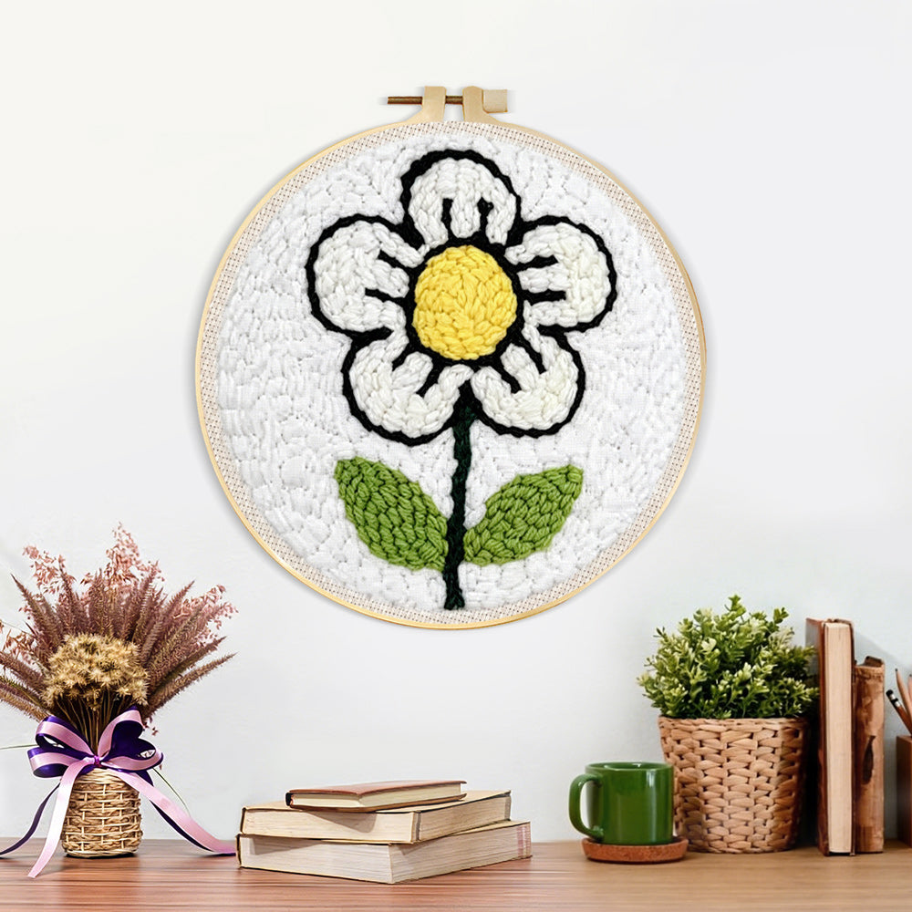 Finished a simple little white flower artwork displayed on a wall