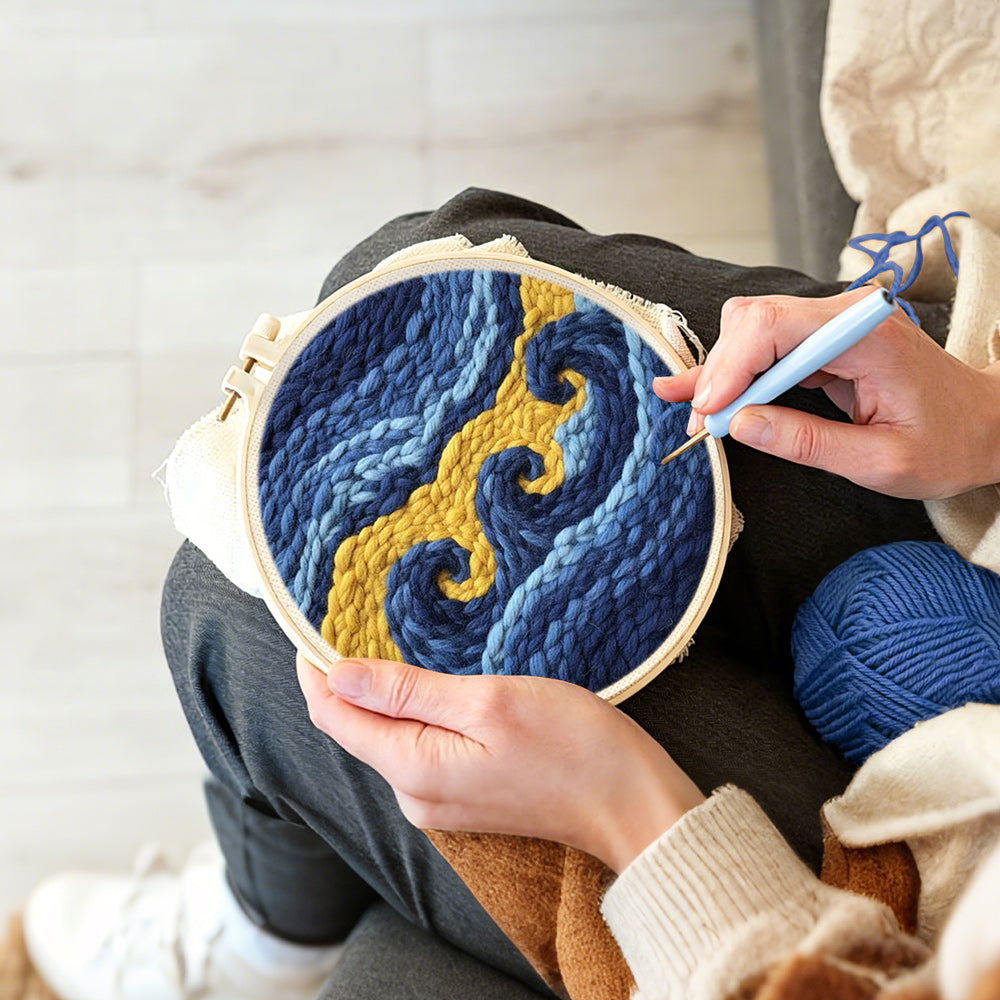 Creating handmade abstract blue and gold waves punch needle artwork