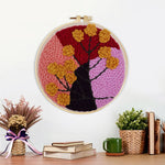 Finished abstract colour block tree with flowers artwork displayed on a wall