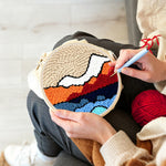 Creating handmade abstract layered mountain punch needle artwork