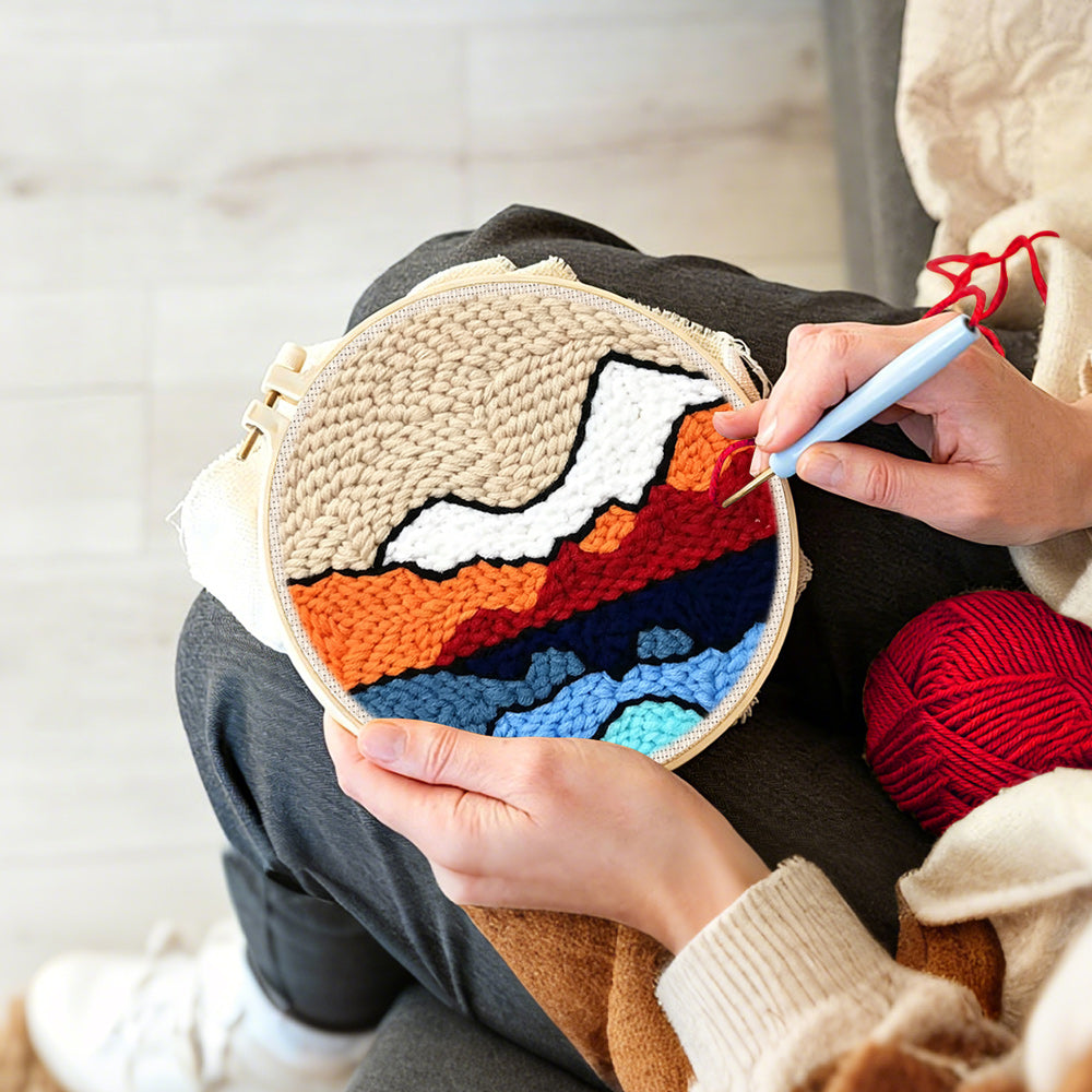 Creating handmade abstract layered mountain punch needle artwork