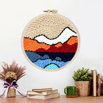 Finished abstract layered mountain artwork displayed on a wall
