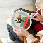 Creating handmade abstract potted plant punch needle artwork