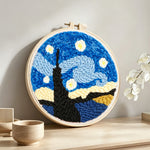 Abstract starry night punch needle artwork displayed on a table
