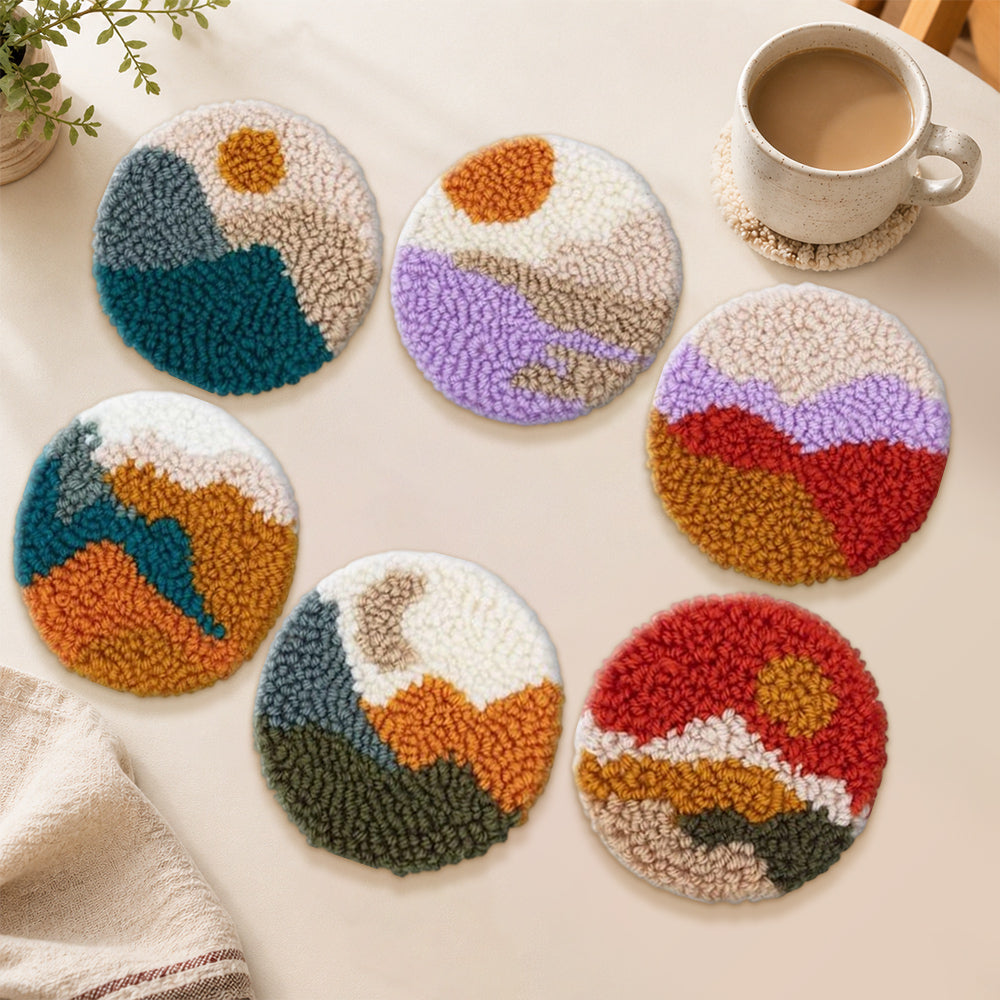 Abstract sun and mountains punch needle coasters used for home decoration