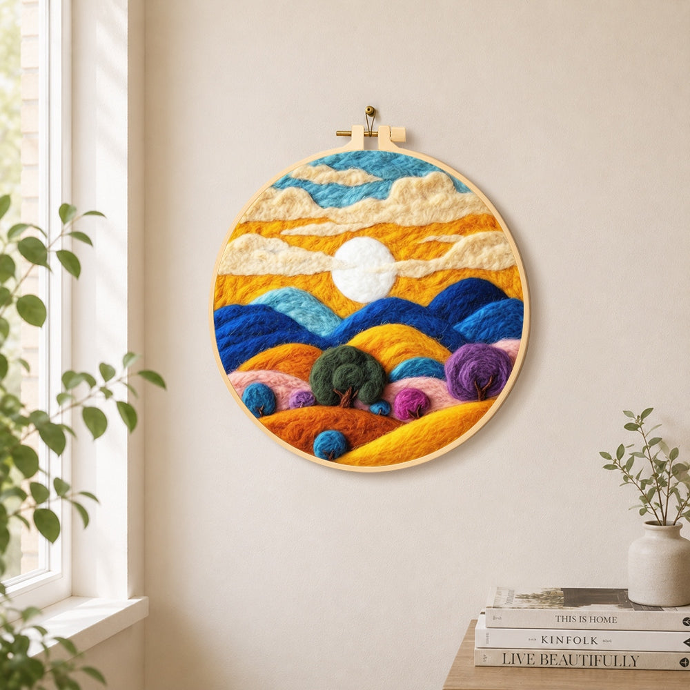 Abstract wavy clouds and colourful hills needle felt wall art displayed in a bright home interior