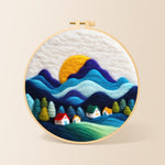 Abstract wavy mountains and tiny houses needle felting kit for beginners with a round wooden frame