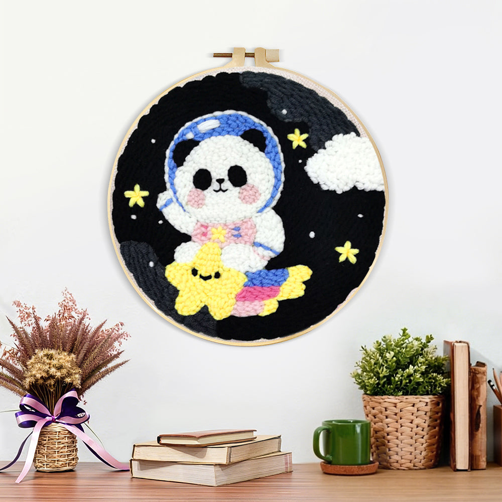 Finished adorable astronaut panda with star artwork displayed on a wall