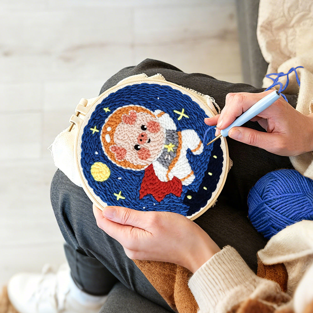 Creating handmade adorable astronaut piggy punch needle artwork