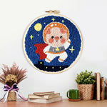 Finished adorable astronaut piggy artwork displayed on a wall