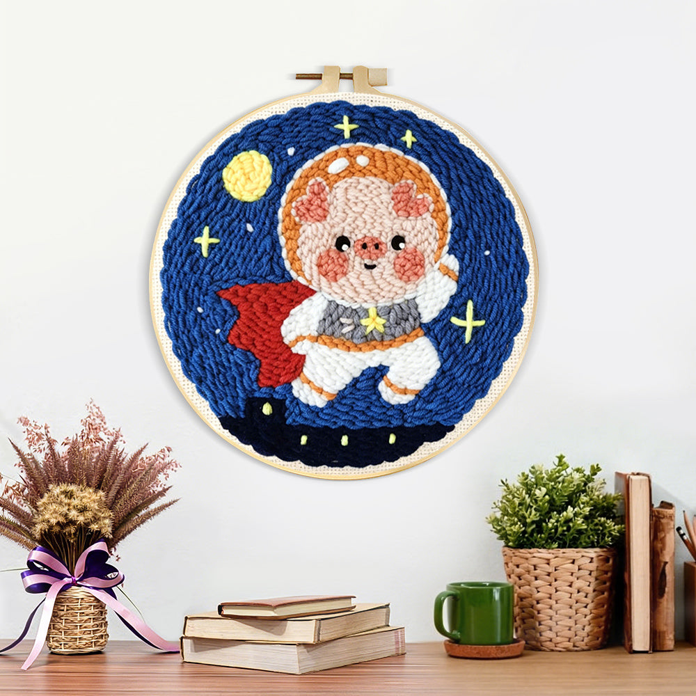 Finished adorable astronaut piggy artwork displayed on a wall