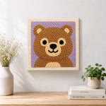 Finished adorable bear face artwork displayed on a wall