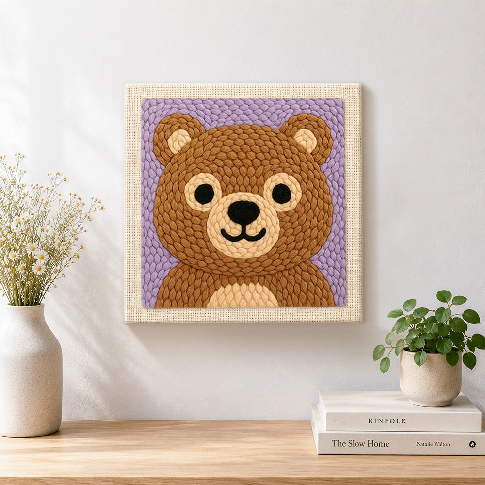 Finished adorable bear face artwork displayed on a wall