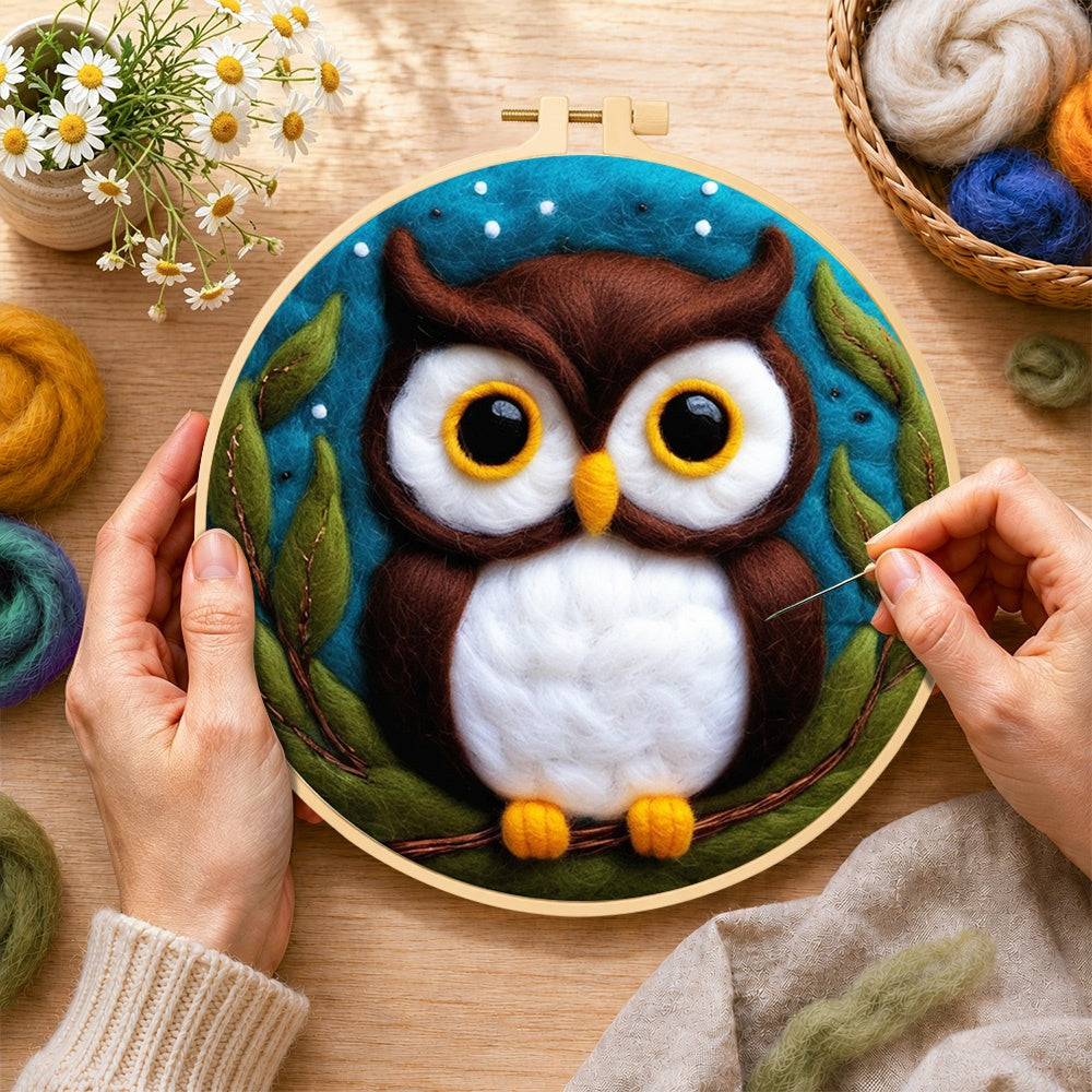Creating the adorable brown and white owl wool painting by hand with a felting needle