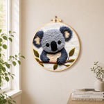 Adorable fluffy koala needle felt wall art displayed in a bright home interior