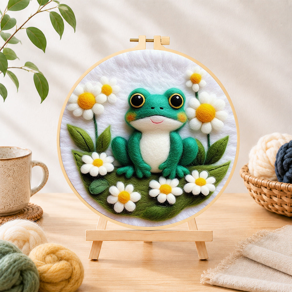 Finished adorable frog with white daisies needle felting displayed on a wooden easel