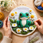 Creating the adorable frog with white daisies wool painting by hand with a felting needle