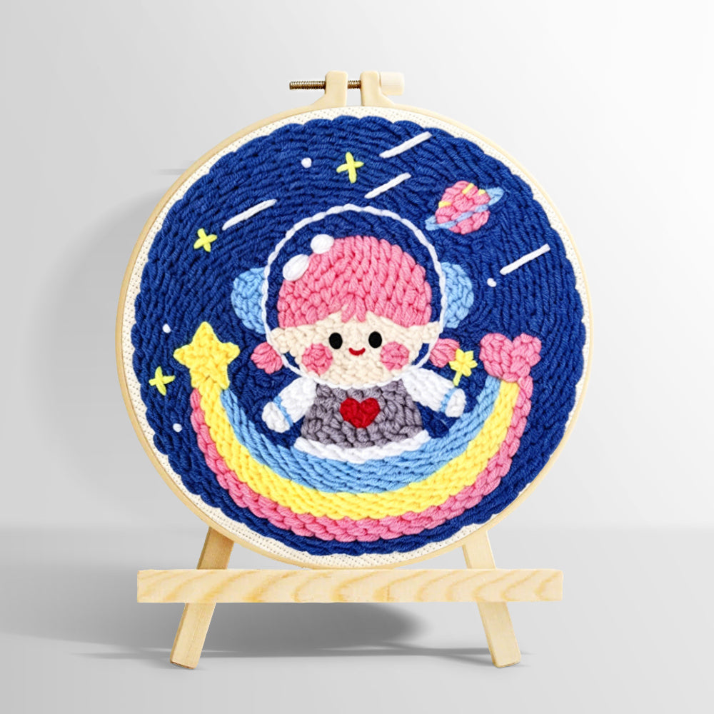 Adorable girl astronaut on rainbow punch needle kit for beginners