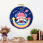 Finished adorable girl astronaut on rainbow artwork displayed on a wall