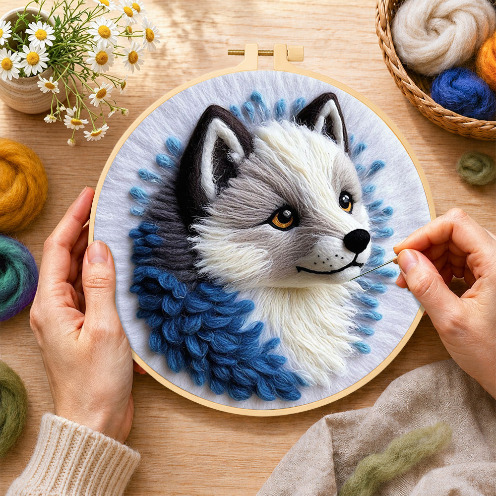 Creating the adorable grey wolf wool painting by hand with a felting needle