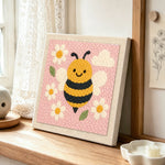 Adorable honey bee punch needle artwork displayed on a table