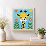 Finished adorable love-themed giraffe artwork displayed on a wall