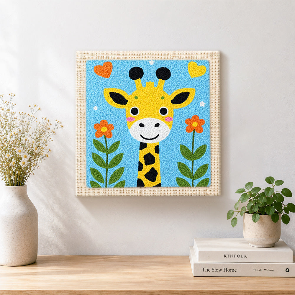 Finished adorable love-themed giraffe artwork displayed on a wall