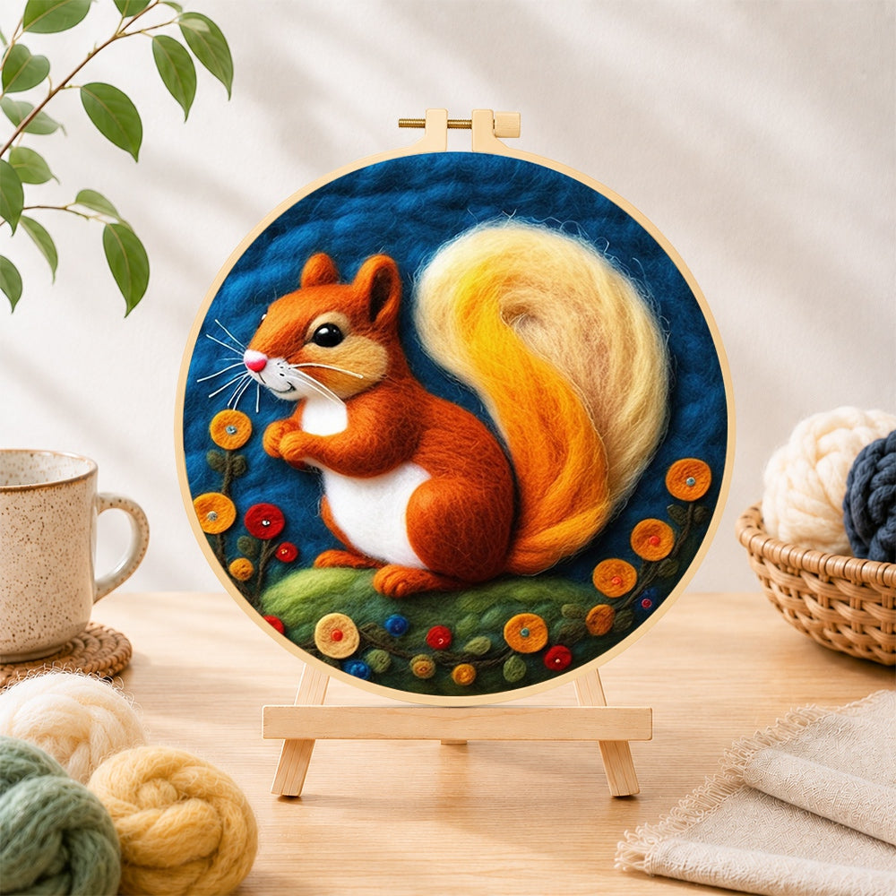 Finished adorable orange squirrel with golden tail needle felting displayed on a wooden easel