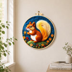 Adorable orange squirrel with golden tail needle felt wall art displayed in a bright home interior