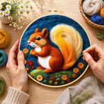 Creating the adorable orange squirrel with golden tail wool painting by hand with a felting needle