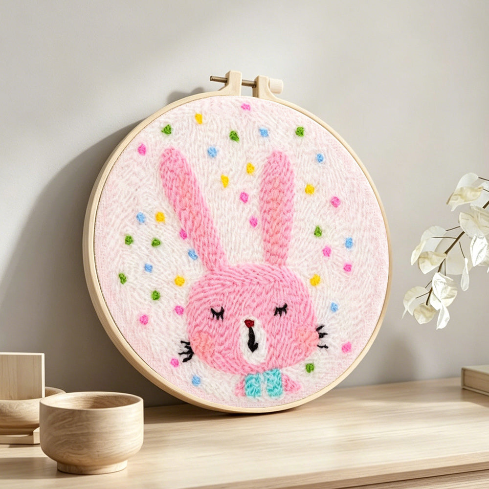 Adorable pink bunny punch needle artwork displayed on a table
