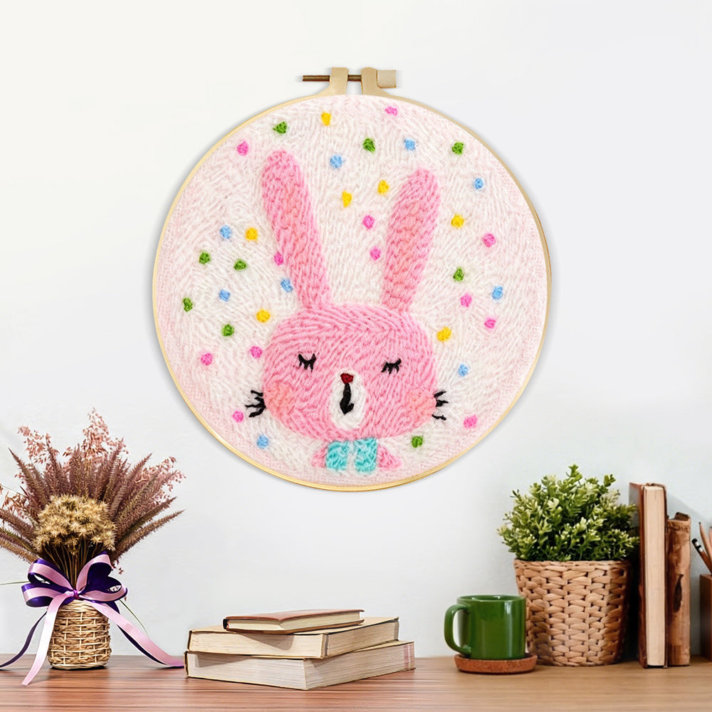 Finished adorable pink bunny artwork displayed on a wall