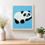 Finished adorable relaxing panda artwork displayed on a wall