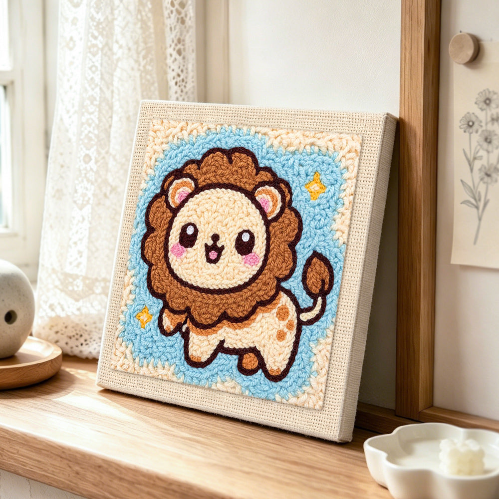 Adorable starry lion punch needle artwork displayed on a table