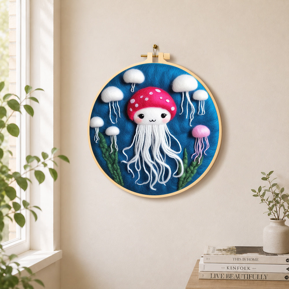 Adorable white jellyfish needle felt wall art displayed in a bright home interior