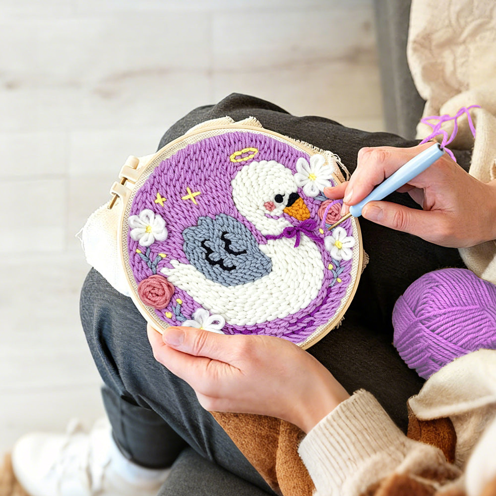 Creating handmade angel swan and flowers punch needle artwork