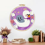 Finished angel swan and flowers artwork displayed on a wall