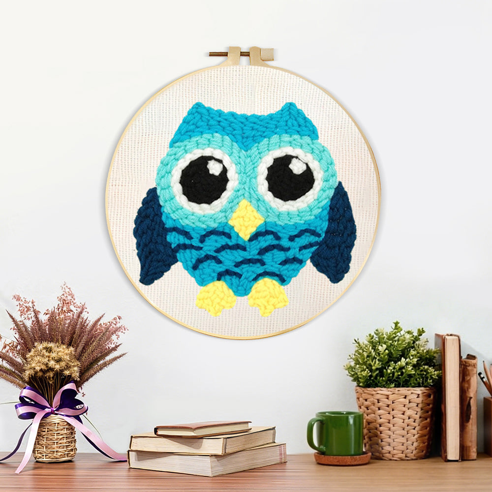Finished aqua owl artwork displayed on a wall