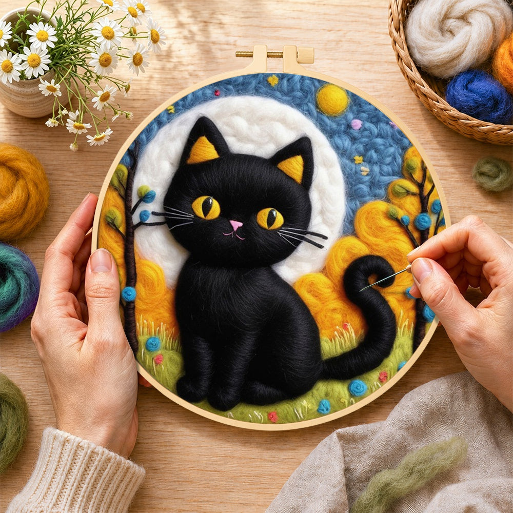 Creating the autumn black cat wool painting by hand with a felting needle