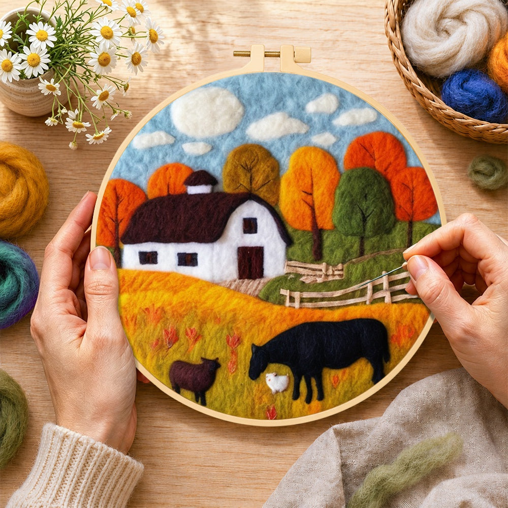 Creating the autumn farm scene wool painting by hand with a felting needle