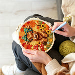 Creating handmade autumn harvest highland cow punch needle artwork