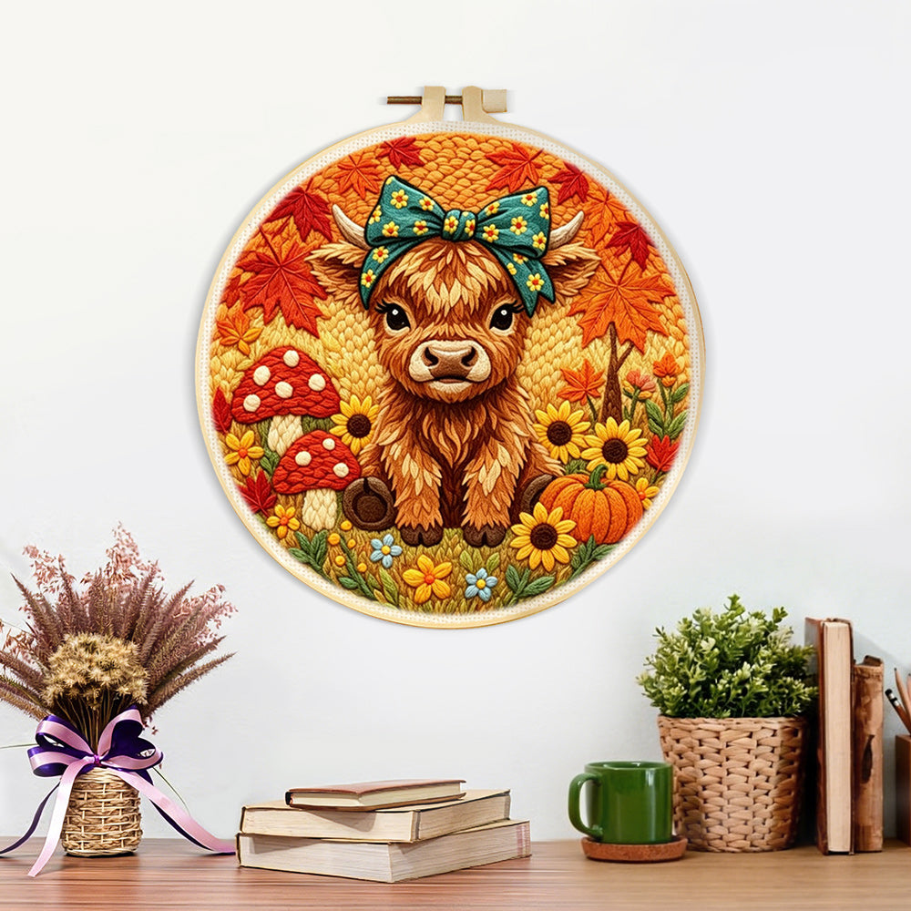Finished autumn harvest highland cow artwork displayed on a wall