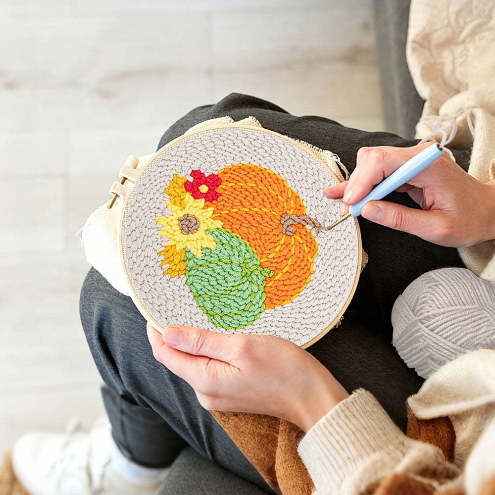 Creating handmade autumn harvest pumpkins punch needle artwork