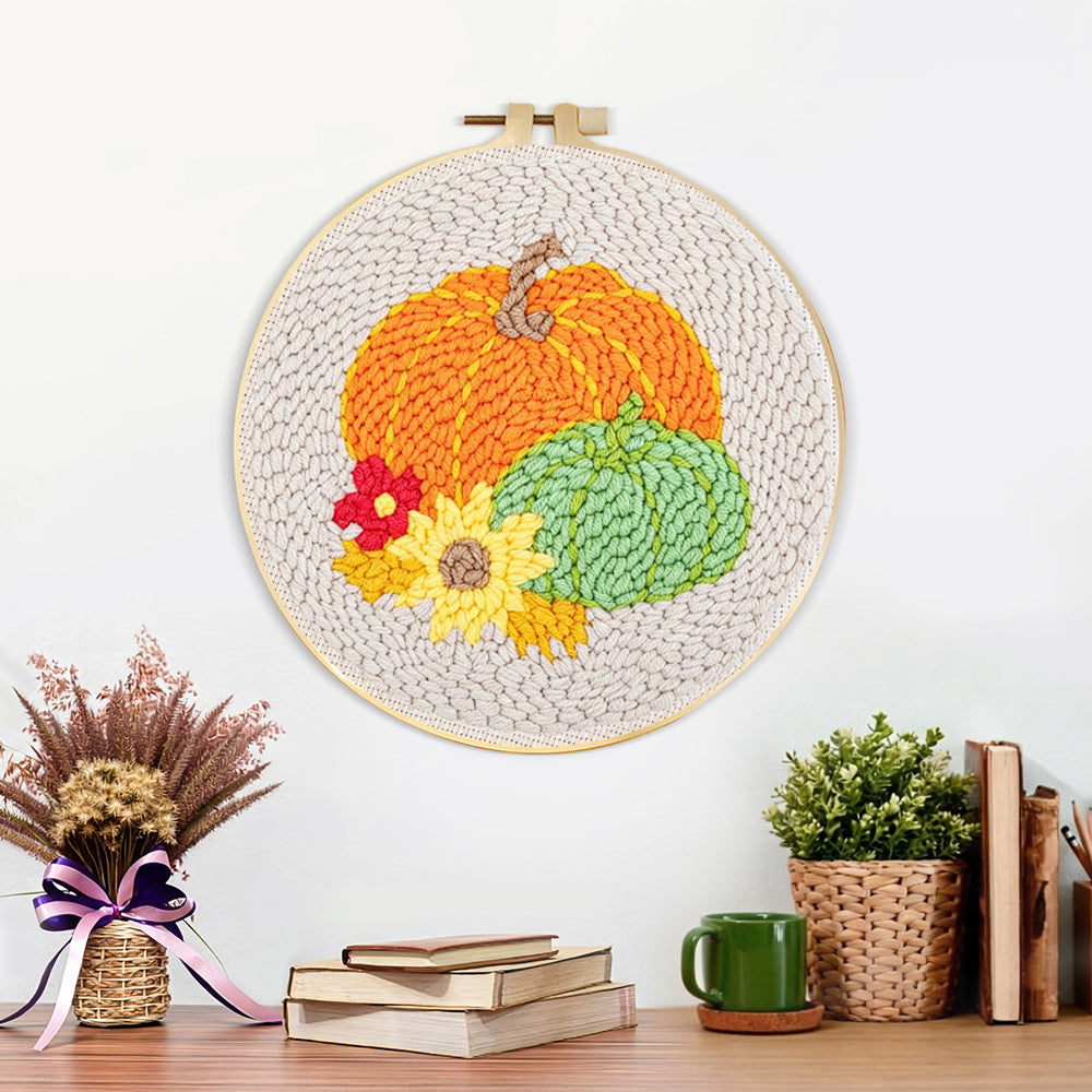 Finished autumn harvest pumpkins artwork displayed on a wall