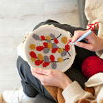 Creating handmade autumn-hued leaves punch needle artwork