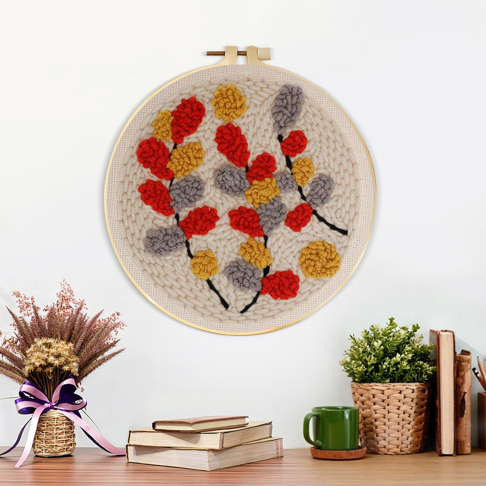 Finished autumn-hued leaves artwork displayed on a wall