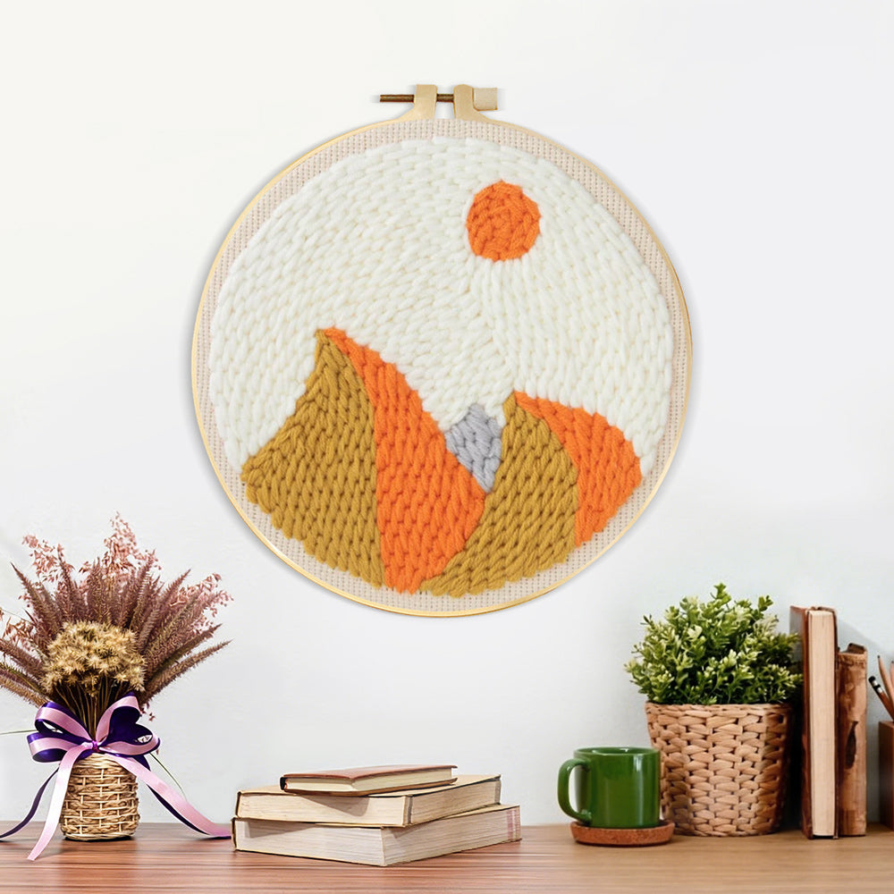 Finished autumn mountain with sun artwork displayed on a wall