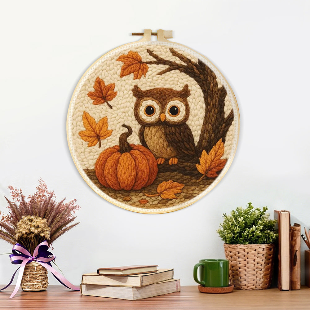 Finished autumn pumpkin and owl artwork displayed on a wall