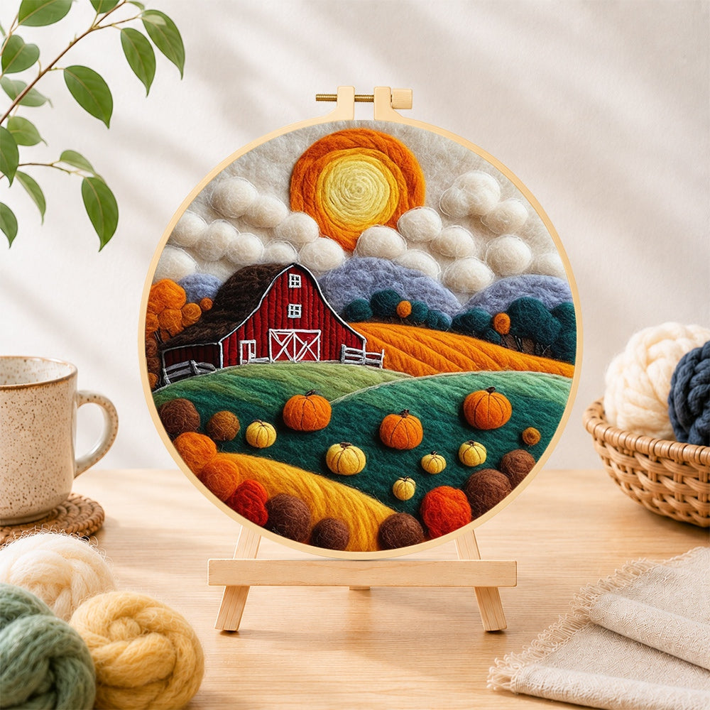 Finished autumn pumpkin harvest farm needle felting displayed on a wooden easel